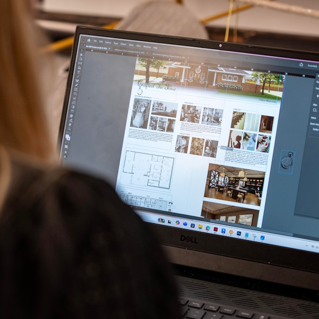 A laptop screen with floorplan and design scheme