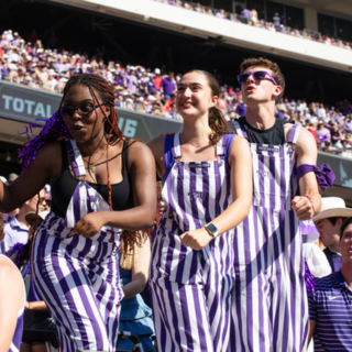 TCU Dutchmen lead the Riff Ram chant during a football game.